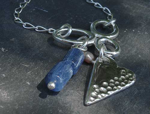 A Celtic necklace for women with a polished silver heart