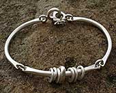 Unusual womens silver bracelet