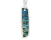 Titanium necklace showcasing a flowing colourful swirl pattern