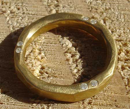 alternative gold diamond eternity ring