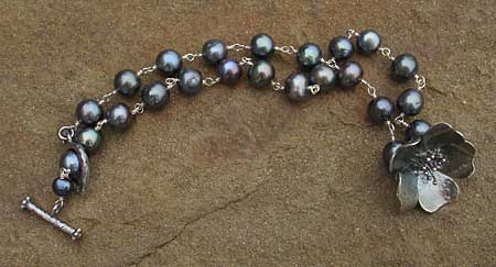 beaded oxidised silver flower necklace