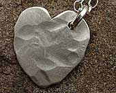 Beaten silver heart necklace