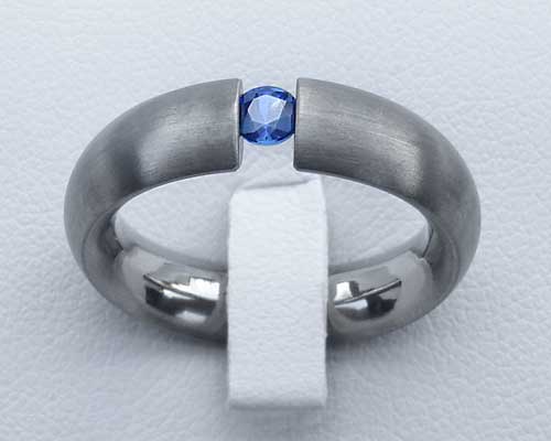 blue diamond tension set engagement ring