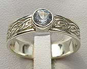 Scottish Celtic engagement ring with a blue topaz