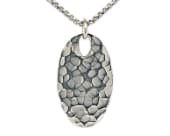 An oval titanium necklace featuring flowing ripple textures
