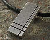 Silver pendant on leather