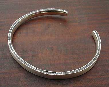 Designer silver torc bracelet