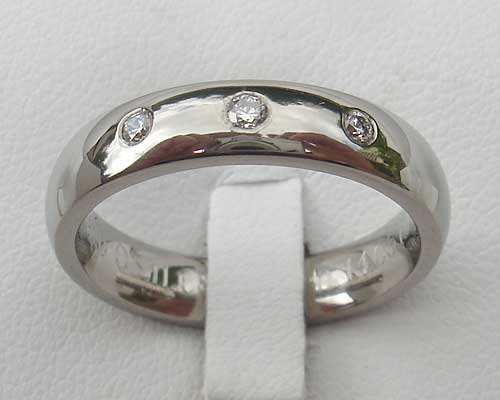 Domed triple diamond set wedding ring