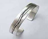 Etched designer cuff bracelet
