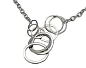 Sterling silver necklace featuring a series of large interlocking silver rings