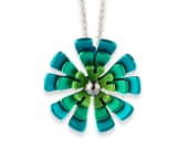 Titanium necklace featuring three ten-petal flowers