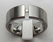 Flat tension set titanium engagement ring