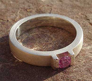 Modern pink sapphire engagement ring