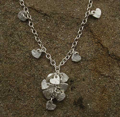multi hearts silver necklace.jpg