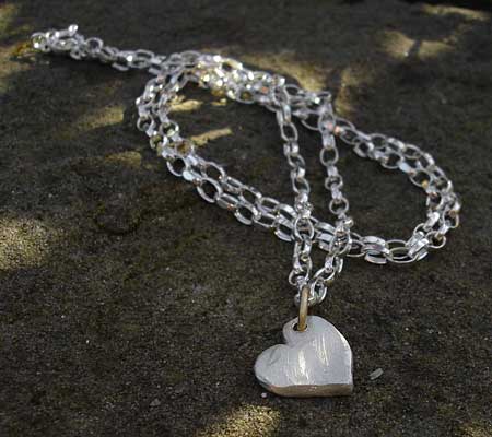 silver chain and heart necklace