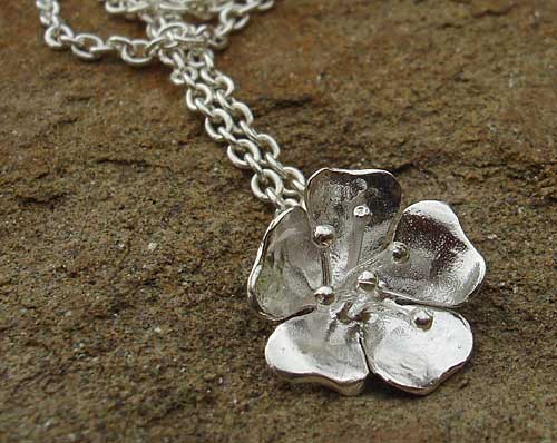 silver flower pendant and chain