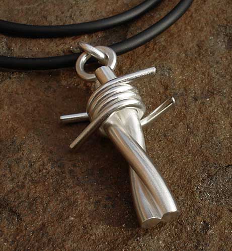 sterling silver barbed wire pendant in rubber