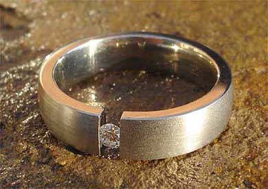 Tension set white diamond titanium engagement ring