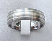 Titanium wedding ring with white gold inlay