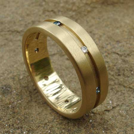 unusual channel set gold ring