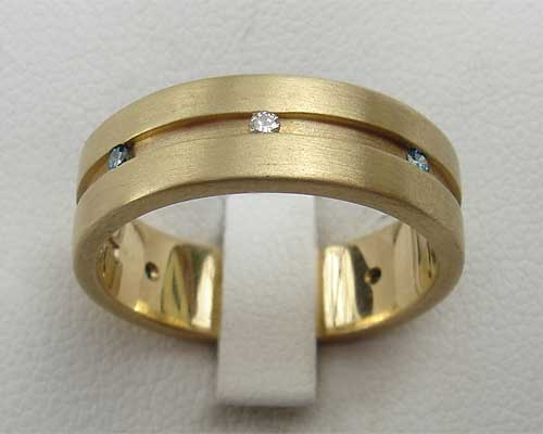unusual channel set gold wedding ring