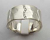 Unusual channel set silver diamond wedding ring
