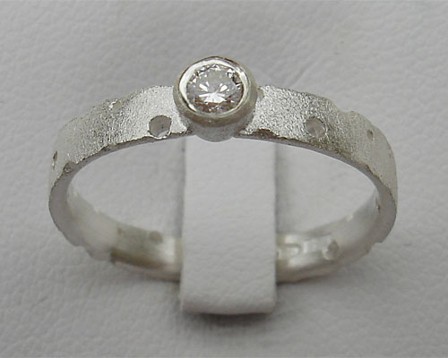 Unusual designer silver engagement ring