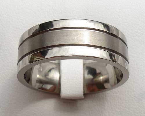 Unusual grooved plain wedding ring
