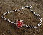 Unusual red heart silver bracelet