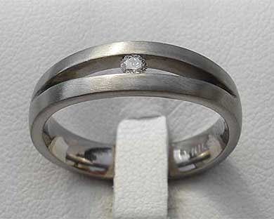 Unusual white diamond titanium engagement ring