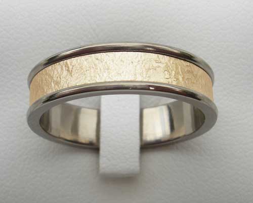 wedding ring in titanium and gold