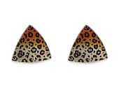 Triangular titanium stud earrings featuring a detailed leopard print design