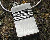 Womens etched silver designer necklace