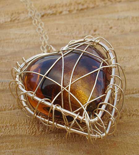 Caged discount heart necklace